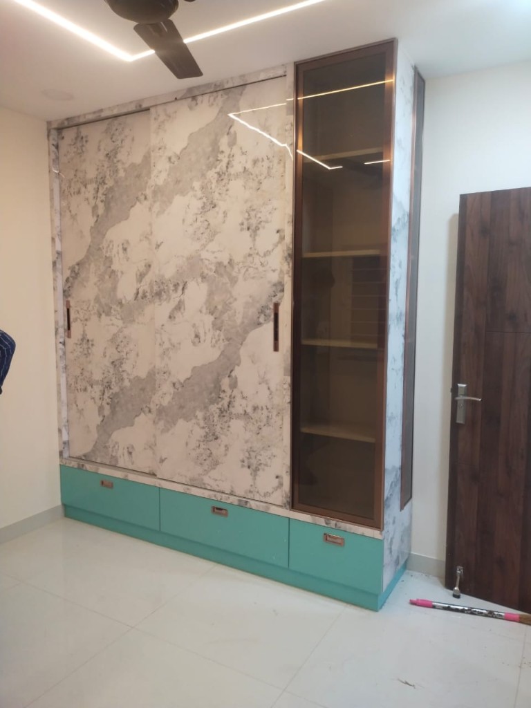 Custom wardrobe with marble panels and glass shelving